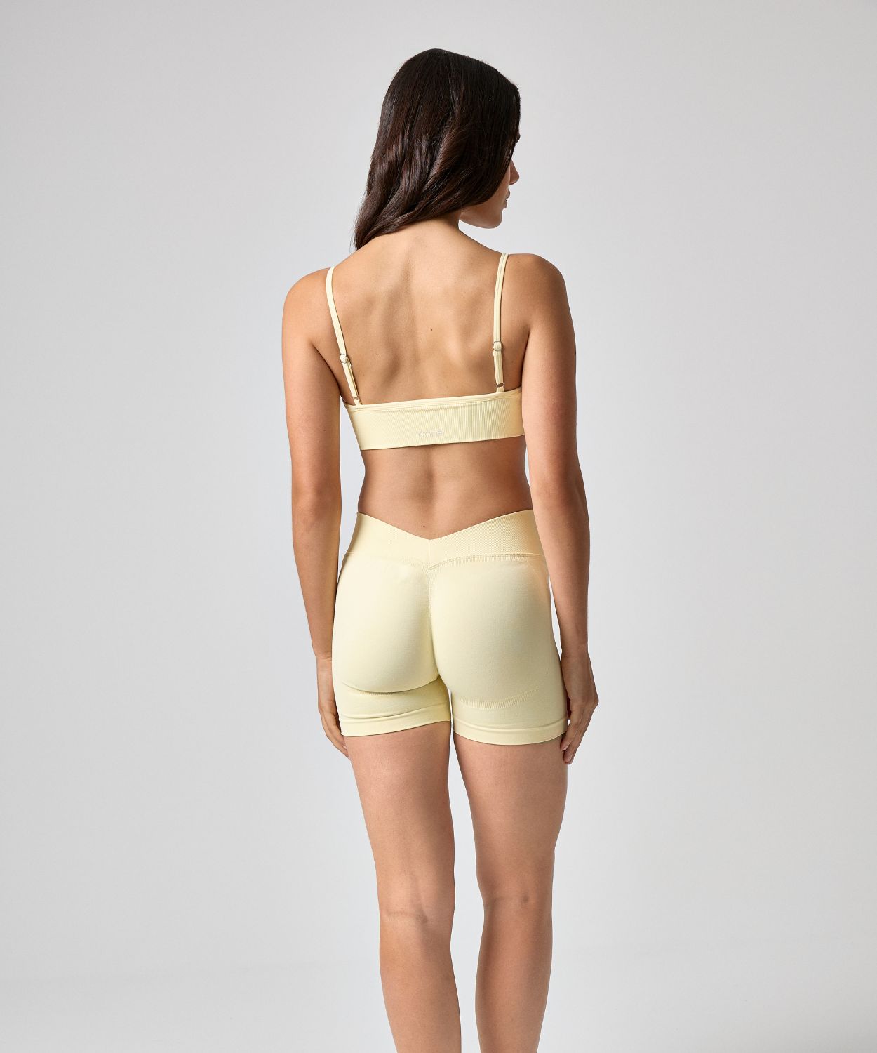 Aeris Short in Creamy Yellow, back view, ÔNNE activewear